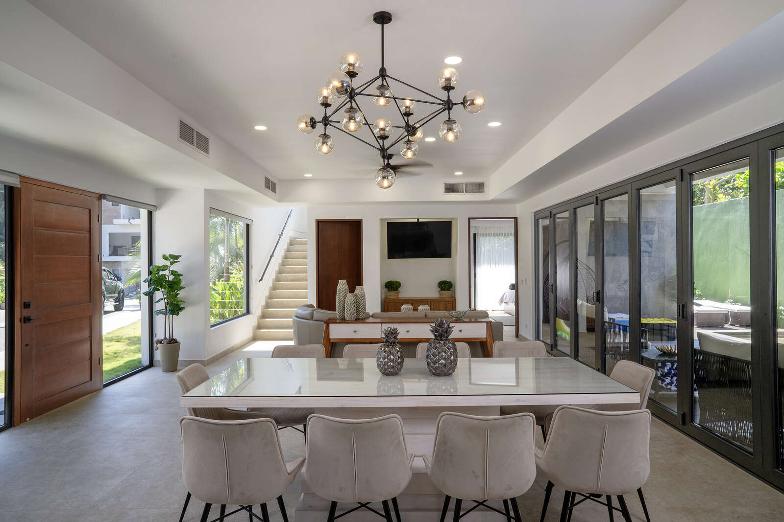 Night view of pool and living area at Villa 3