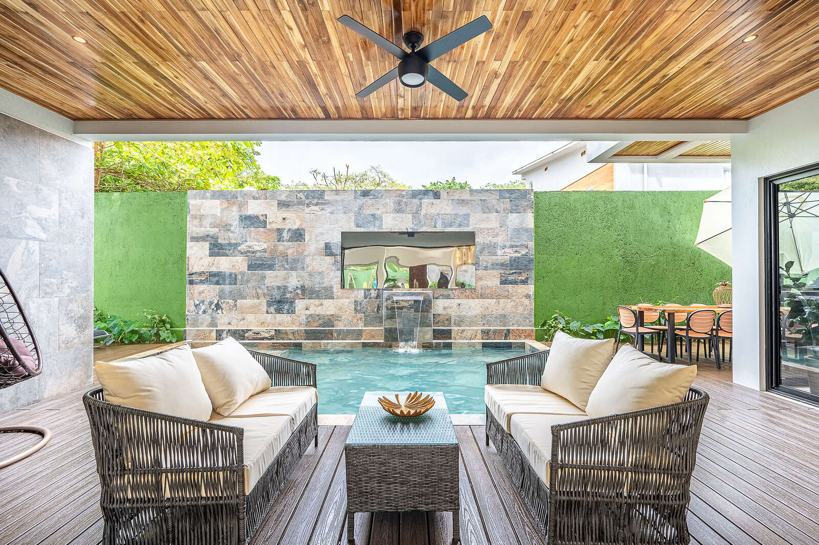 Night view of pool and living area at Villa 3