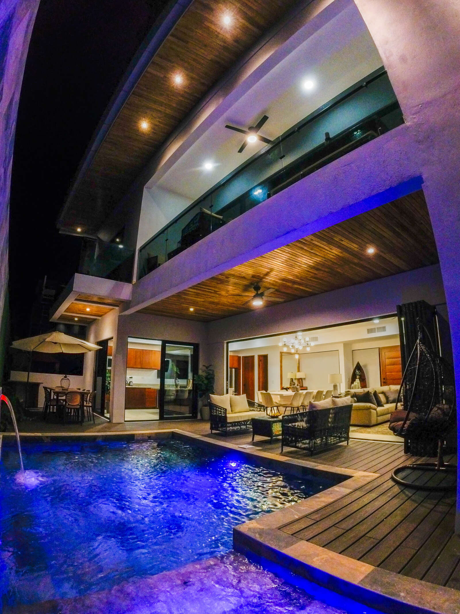 Night view of pool and living area at Villa 3
