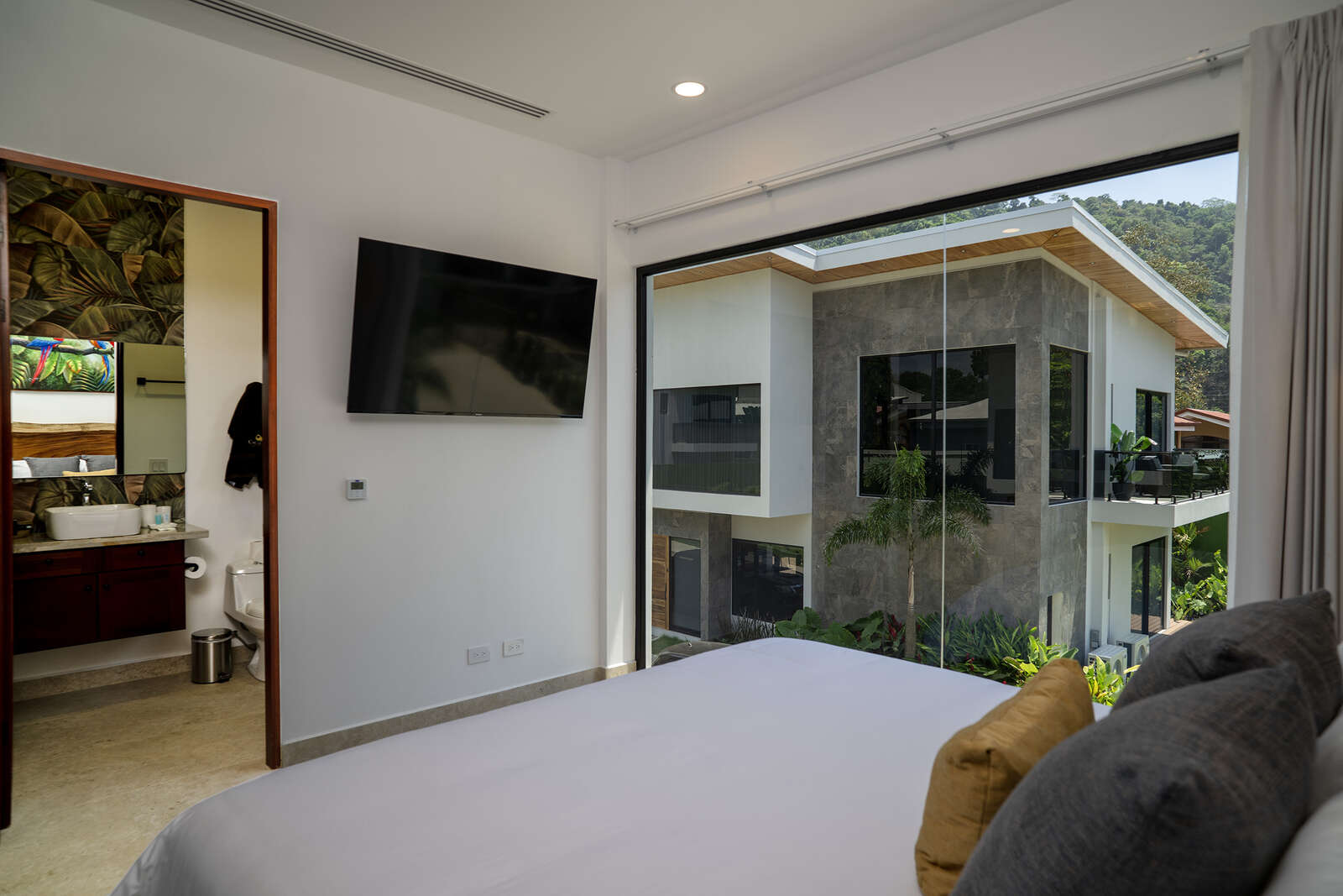 Night view of pool and living area at Villa 3