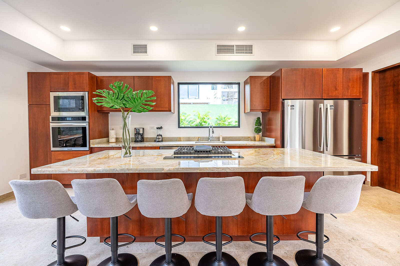 Night view of pool and living area at Villa 3