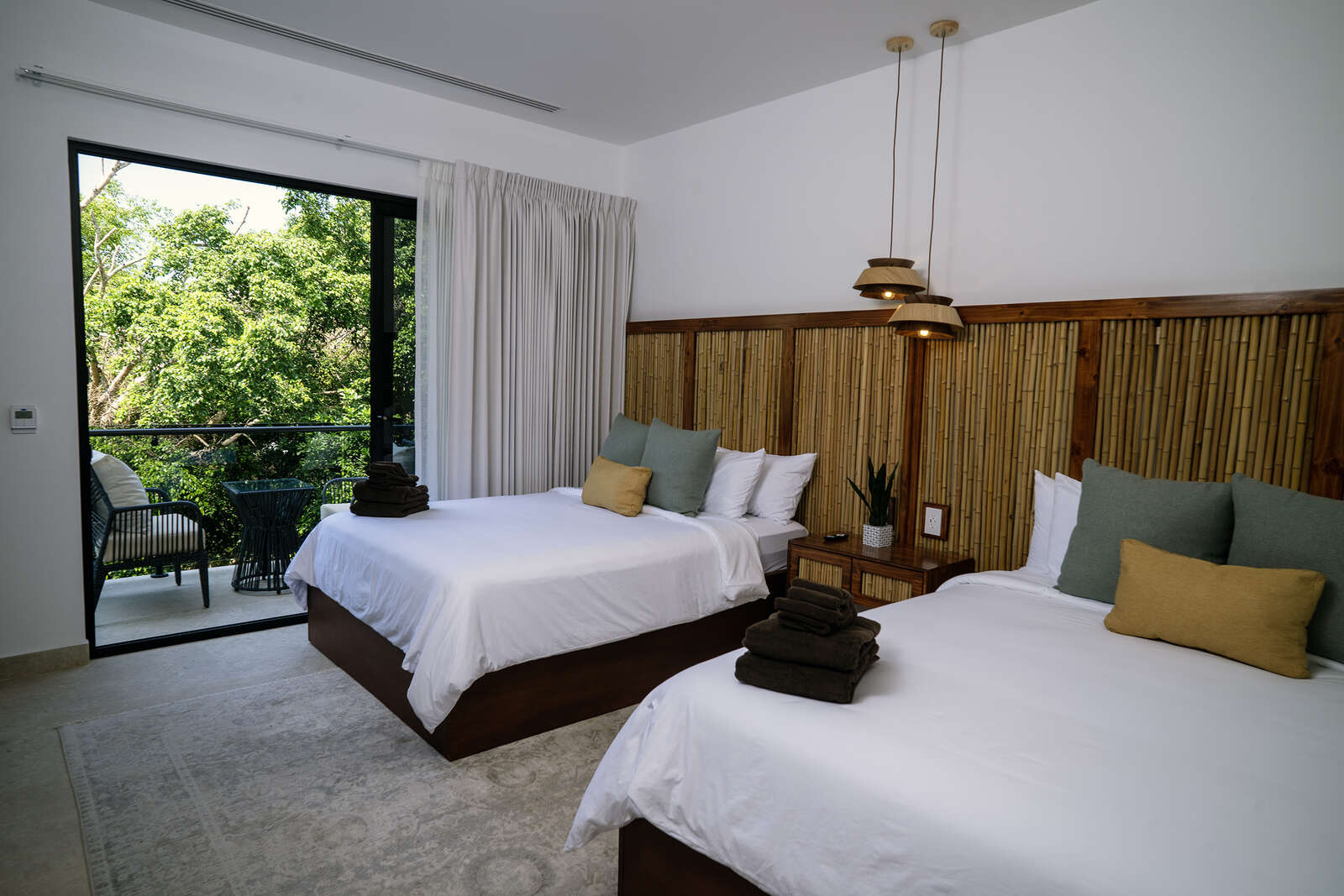 Night view of pool and living area at Villa 3