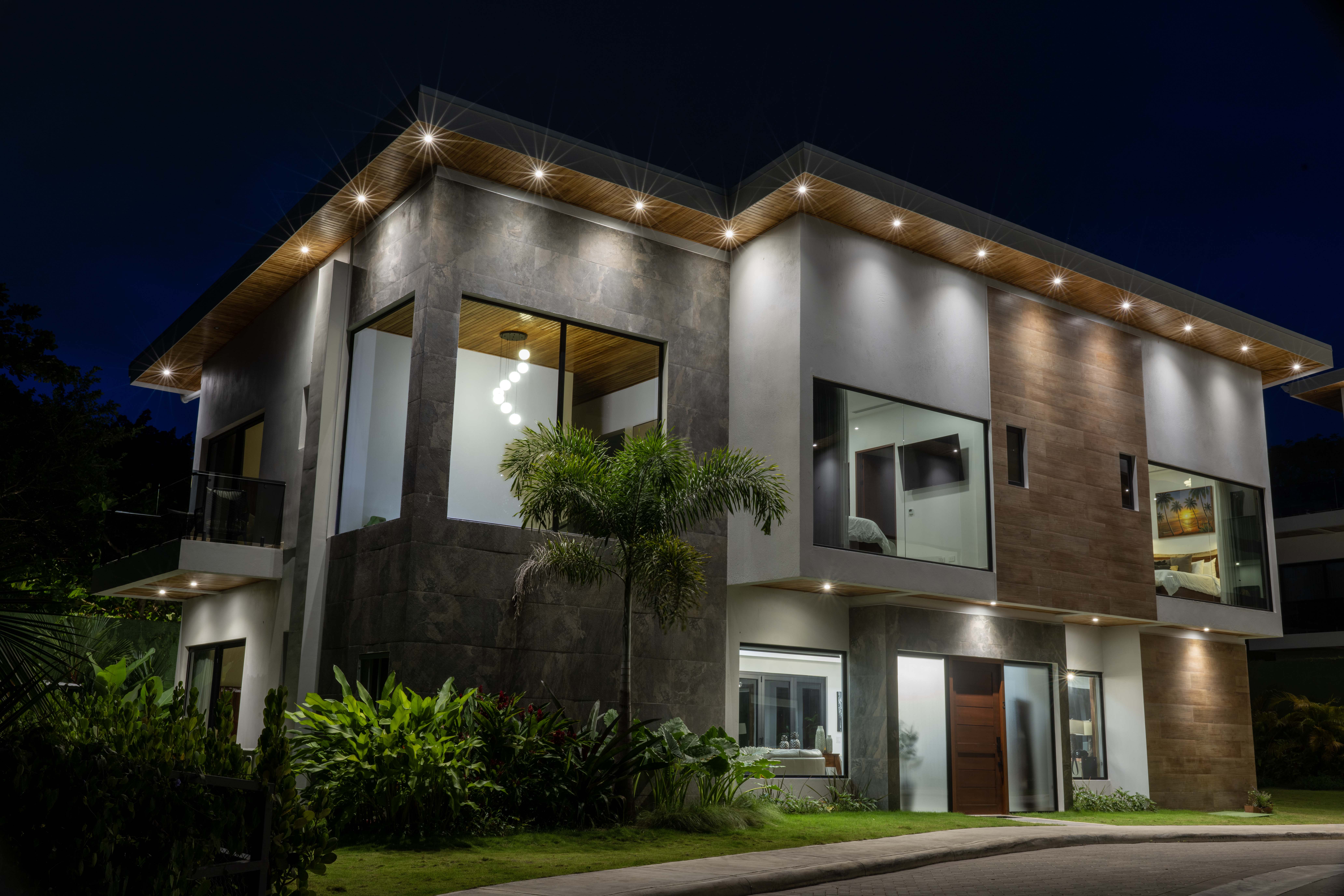 Night view of pool and living area at Villa 3